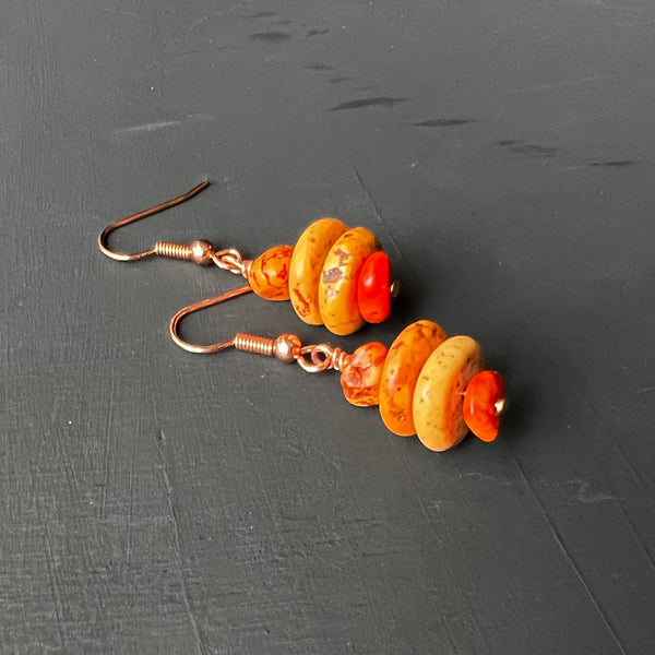 Dyed orange stones on copper earrings