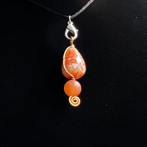 Dyed faceted agate pendant on copper