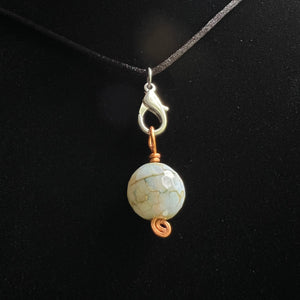 Faceted dyed agate round pendant on copper