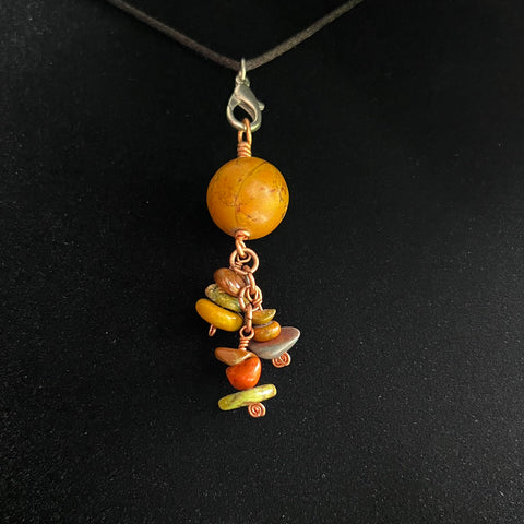 Dyed stone pendant with dangles on copper