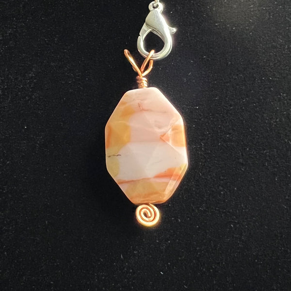 Long octagon faceted stone pendant on copper