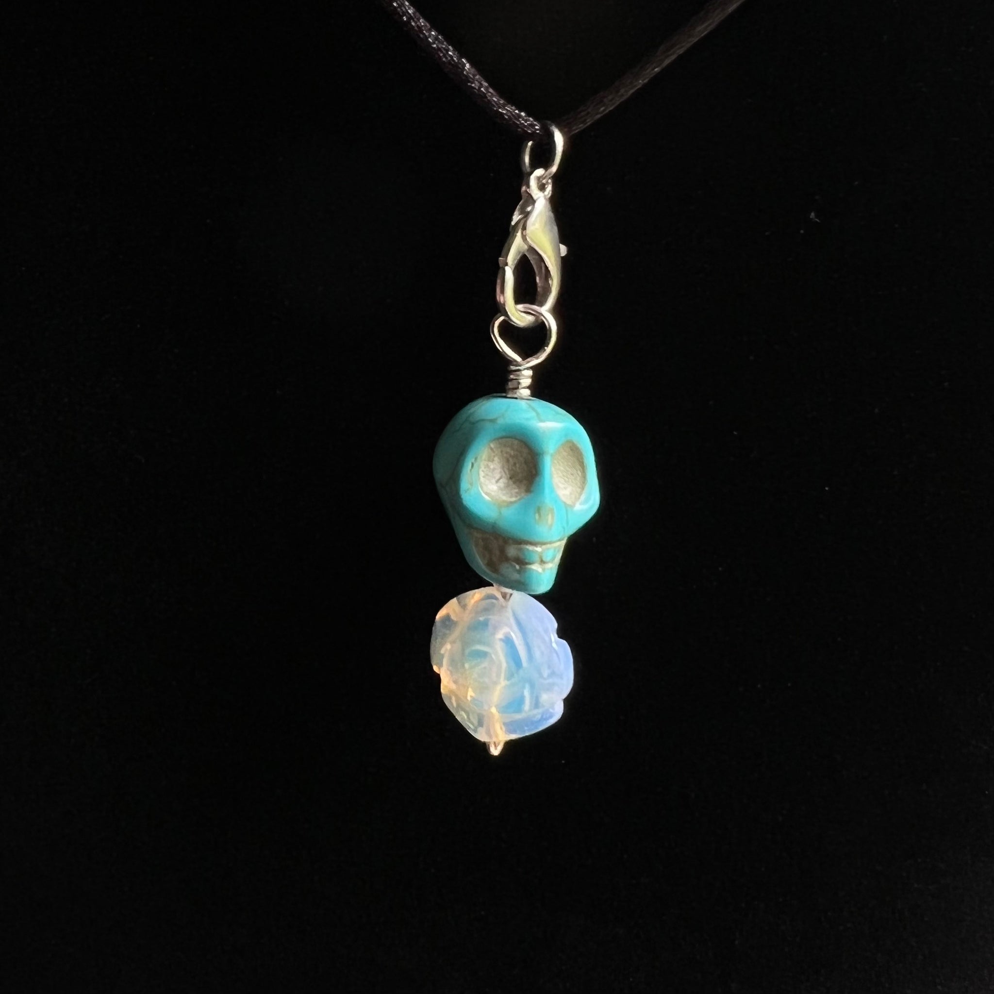 Blue dyed stone skull with opalite rose pendant