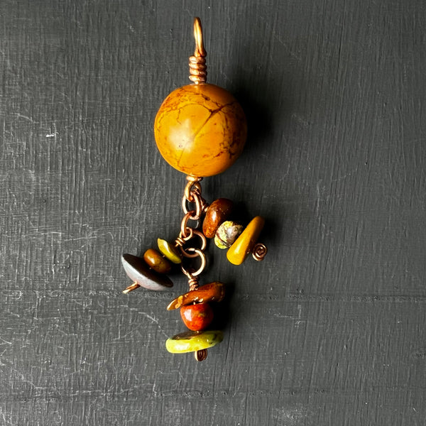 Dyed stone pendant with dangles on copper
