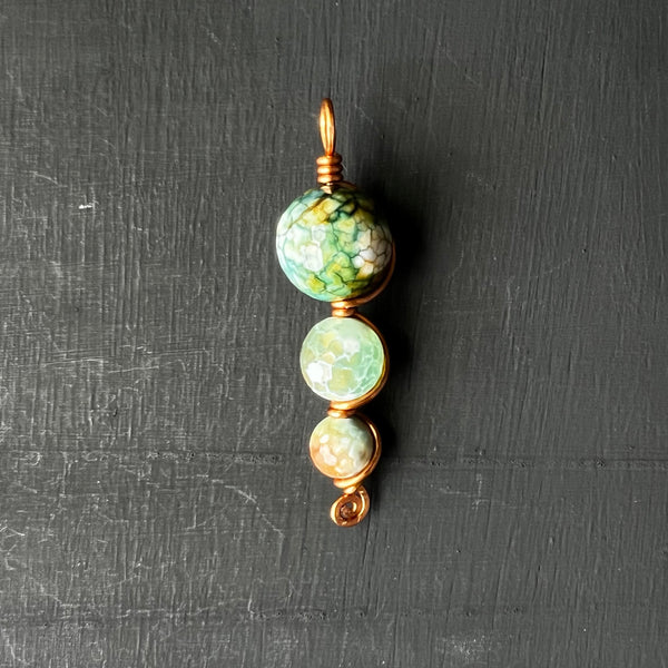 Green dyed faceted agate pendant on copper